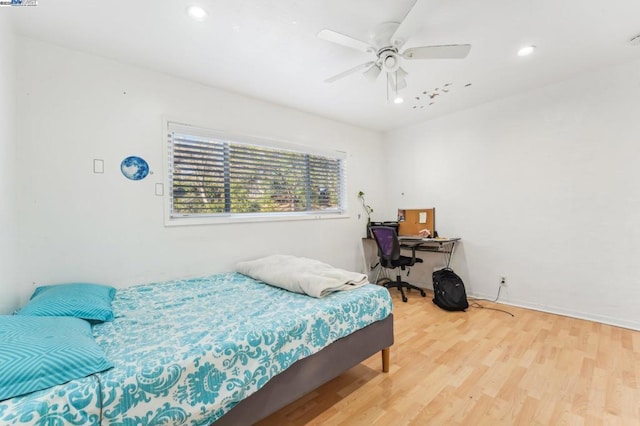 bedroom featuring ceiling fan and hardwood / wood-style flooring