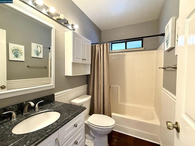 full bathroom with toilet, shower / tub combo, and vanity