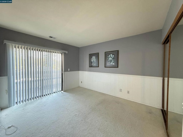 spare room with light colored carpet