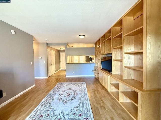 unfurnished living room with light hardwood / wood-style floors