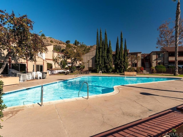 view of swimming pool featuring a patio