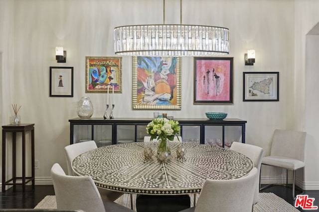 dining space with dark wood-type flooring