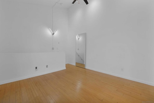 unfurnished room featuring wood-type flooring and ceiling fan