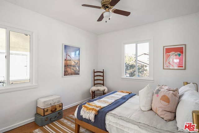 bedroom with ceiling fan and wood-type flooring