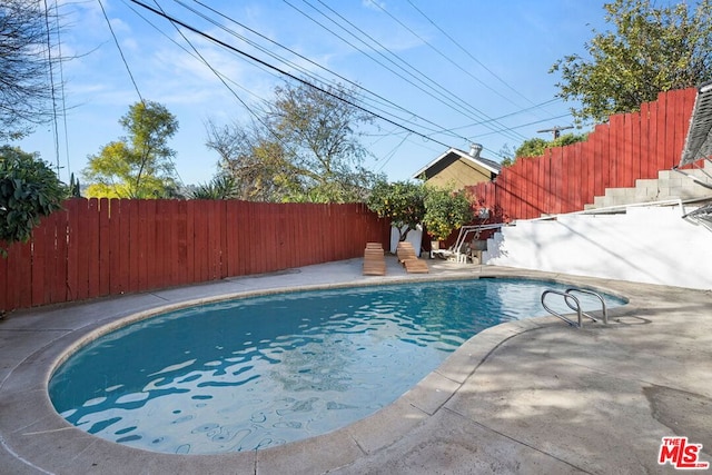 view of pool featuring a patio