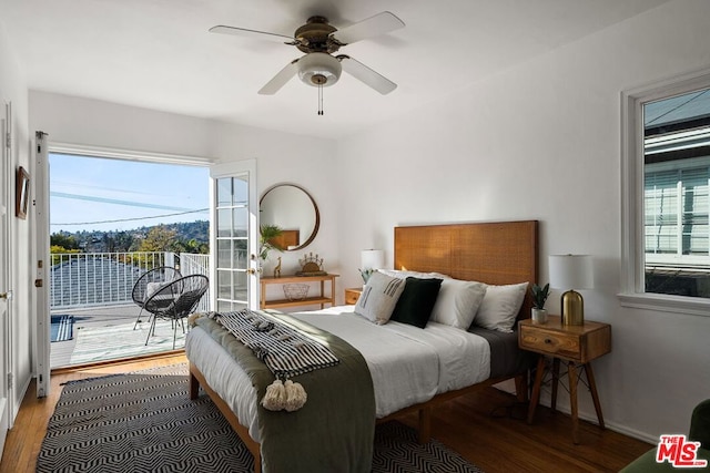 bedroom featuring multiple windows, ceiling fan, and wood-type flooring