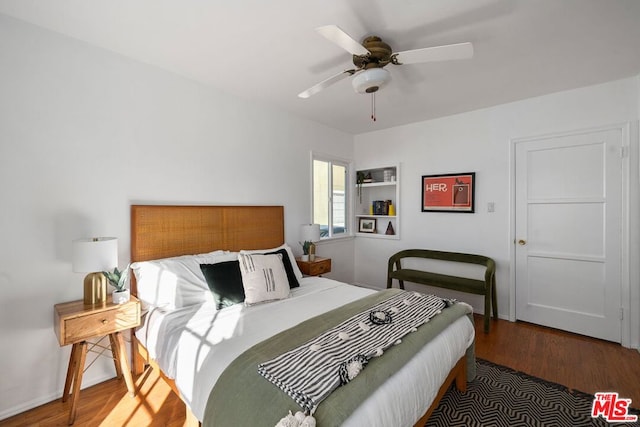 bedroom with ceiling fan and hardwood / wood-style floors