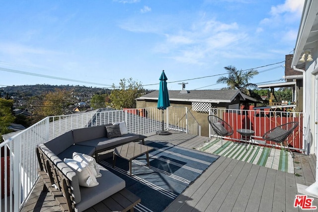 wooden terrace featuring an outdoor hangout area