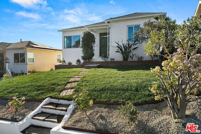 view of front of home with a front lawn