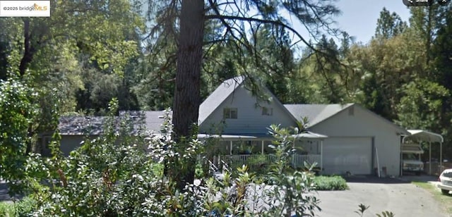 view of front facade featuring a garage and covered porch