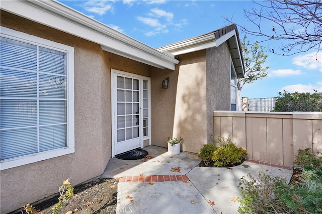 doorway to property with a patio