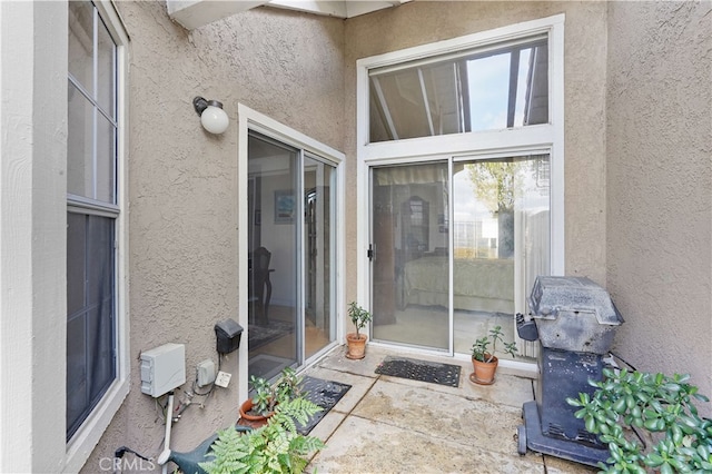 entrance to property with a patio area