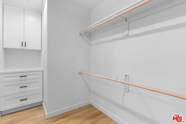 spacious closet featuring light wood-type flooring