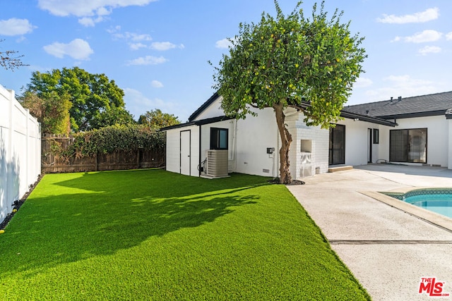 exterior space featuring a patio area and a fenced in pool