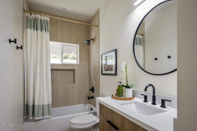 full bathroom featuring shower / bath combo with shower curtain, vanity, and toilet