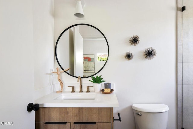 bathroom with vanity and toilet