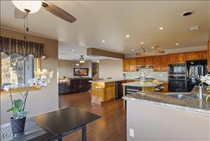 kitchen featuring ceiling fan and sink