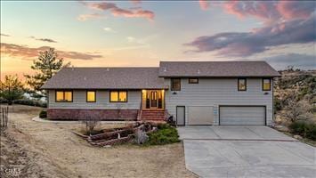 view of front of property with a garage