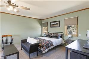 bedroom featuring ceiling fan, light carpet, and ornamental molding