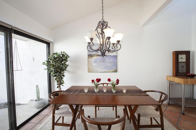 tiled dining area with a chandelier and vaulted ceiling