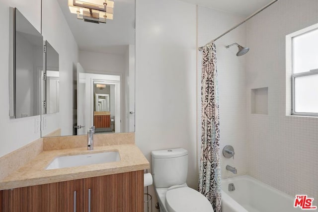 full bathroom featuring vanity, toilet, and shower / tub combo