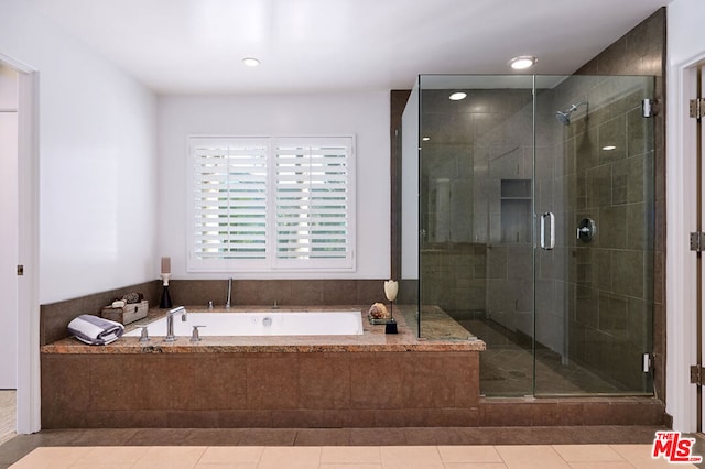 bathroom featuring separate shower and tub and tile patterned flooring