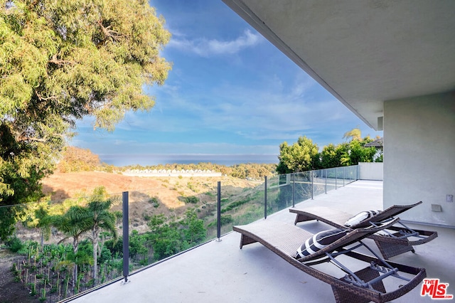 view of patio with a balcony