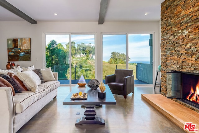 living room featuring a fireplace and beamed ceiling