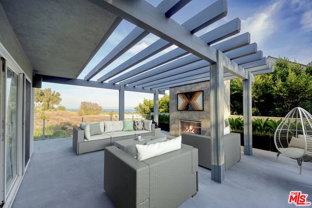 view of patio with an outdoor living space with a fireplace and a pergola