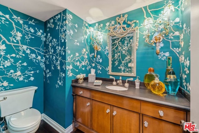 bathroom with vanity and toilet