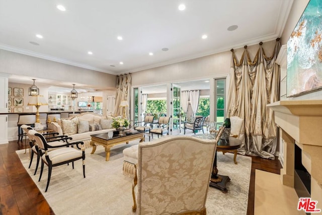 living room with ornamental molding and light wood-type flooring