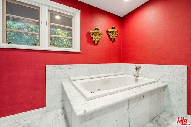 bathroom with tiled tub