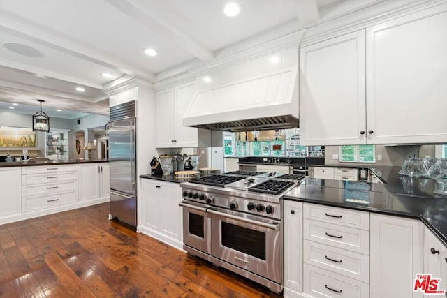 kitchen featuring beam ceiling, premium range hood, white cabinetry, and high end appliances