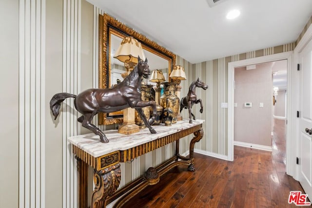 hall with dark hardwood / wood-style flooring