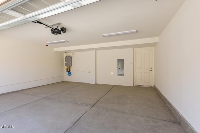 garage featuring a garage door opener and electric panel