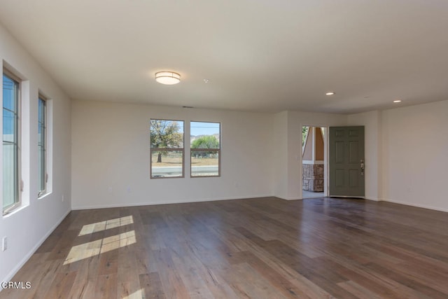 empty room featuring dark hardwood / wood-style floors