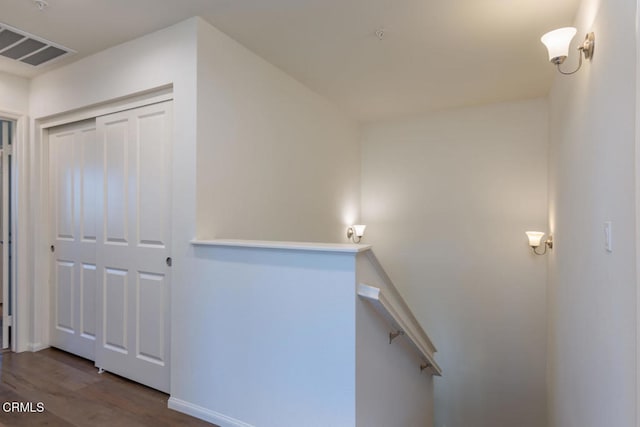 stairs featuring hardwood / wood-style flooring