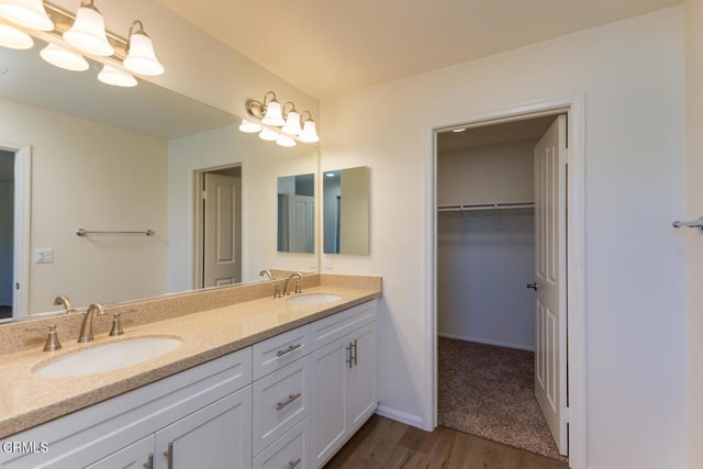 bathroom featuring vanity and wood-type flooring