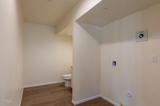 bathroom featuring wood-type flooring and toilet