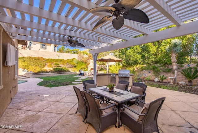 view of patio / terrace with a pergola, area for grilling, an outdoor kitchen, and exterior fireplace