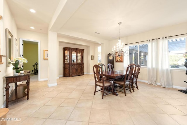 dining room featuring a chandelier and light tile patterned floors