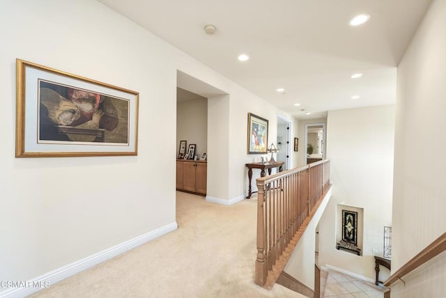 corridor with light colored carpet