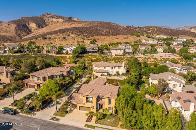 drone / aerial view featuring a mountain view