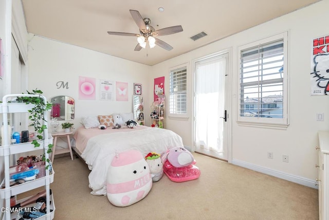 carpeted bedroom with ceiling fan