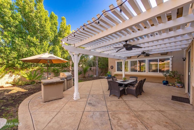 view of patio / terrace featuring a pergola, grilling area, and an outdoor kitchen