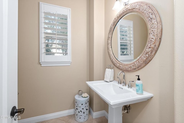 bathroom with sink, plenty of natural light, and tile patterned flooring