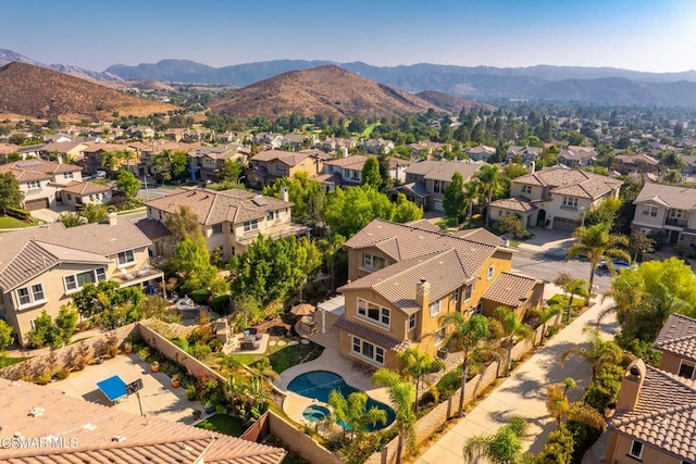 birds eye view of property featuring a mountain view