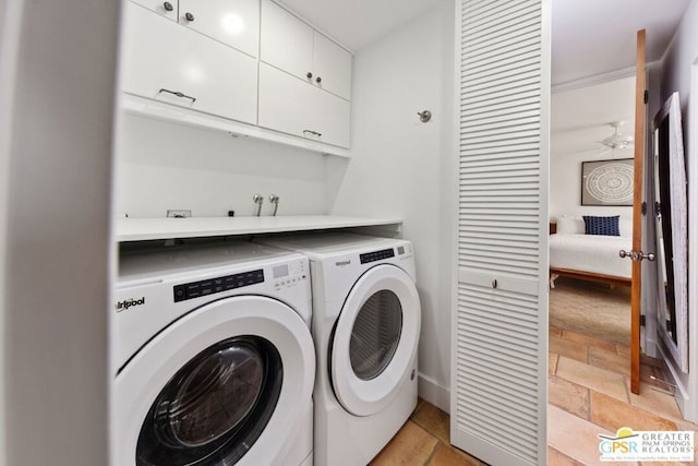 laundry room with ceiling fan, washer and clothes dryer, and cabinets