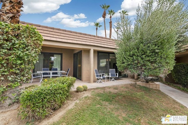 back of house featuring a patio