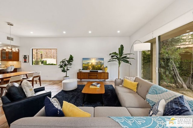 living room featuring a chandelier